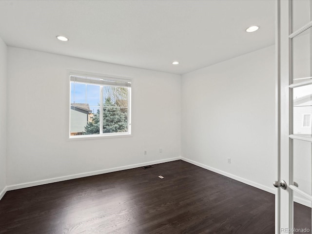 10730 Hillrose St, Parker, CO 80134 - empty room with dark wood finished floors, baseboards, and recessed lighting