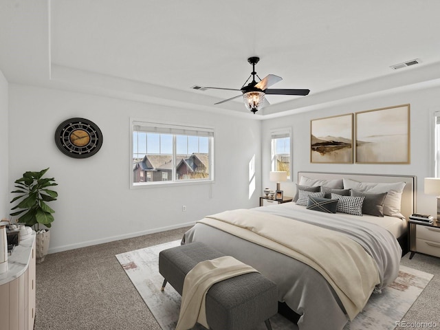 10730 Hillrose St, Parker, CO 80134 - bedroom with light carpet, a raised ceiling, baseboards, and a ceiling fan