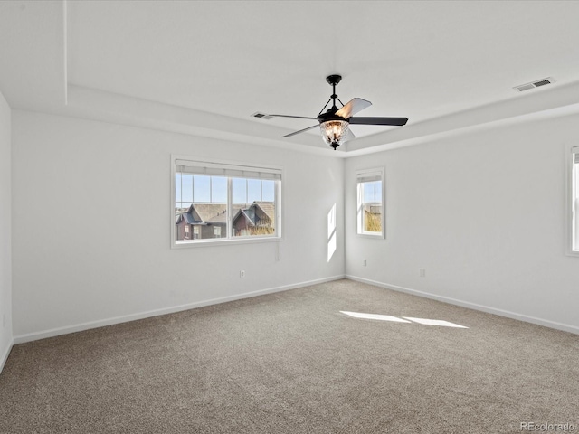10730 Hillrose St, Parker, CO 80134 - carpeted empty room with a ceiling fan, baseboards, and a tray ceiling