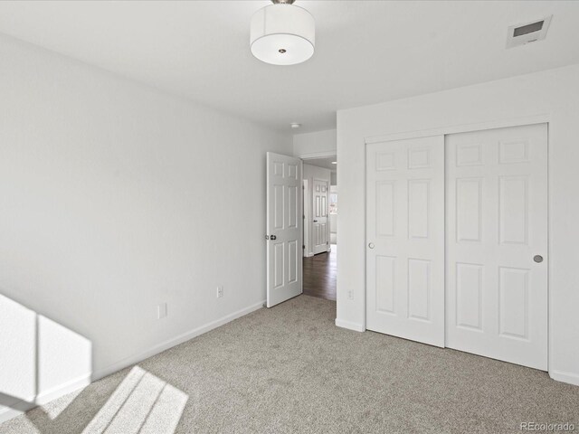 10730 Hillrose St, Parker, CO 80134 - unfurnished bedroom with carpet flooring, baseboards, and a closet