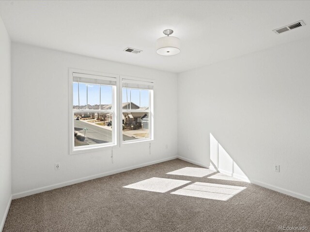 10730 Hillrose St, Parker, CO 80134 - spare room featuring carpet flooring and baseboards