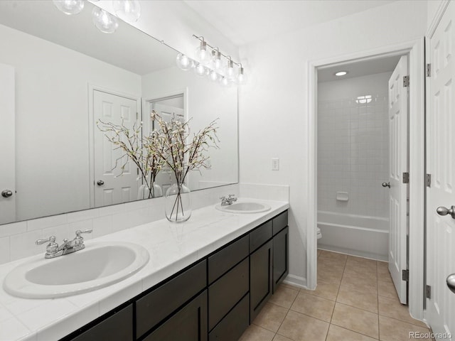 10730 Hillrose St, Parker, CO 80134 - bathroom with tile patterned floors, double vanity, and toilet