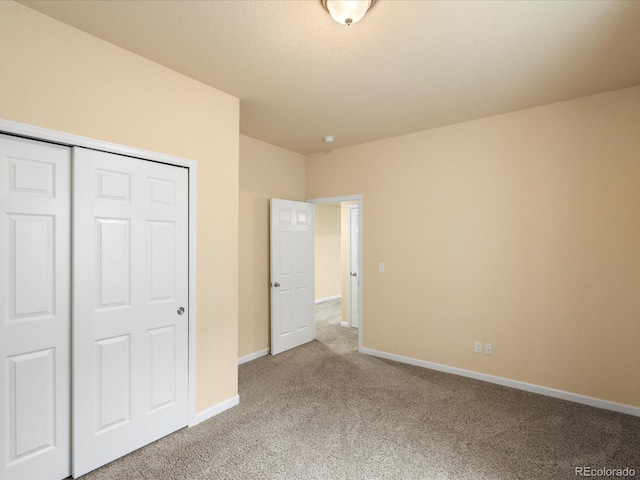 10730 Hillrose St, Parker, CO 80134 - unfurnished bedroom with carpet flooring, baseboards, and a closet