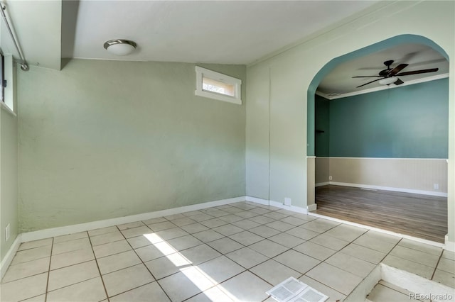 unfurnished room with light wood-type flooring, crown molding, and ceiling fan