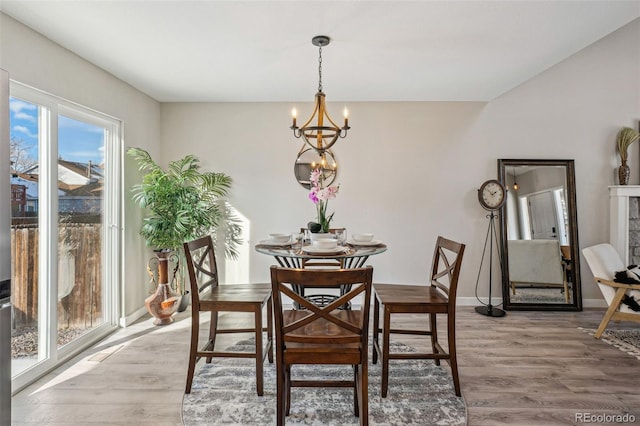 dining room featuring hardwood / wood-style flooring and a notable chandelier