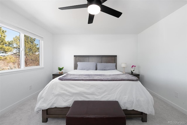 carpeted bedroom featuring a ceiling fan and baseboards