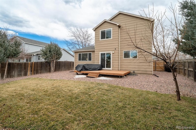 back of house with a lawn, a fenced backyard, and a wooden deck