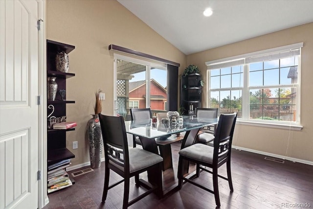 dining room featuring lofted ceiling, baseboards, dark wood-style floors, and visible vents