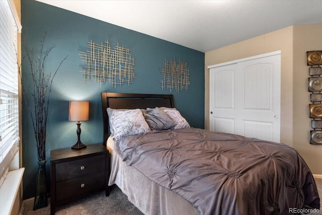 carpeted bedroom with a closet