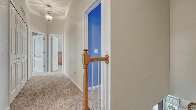 corridor featuring carpet and visible vents