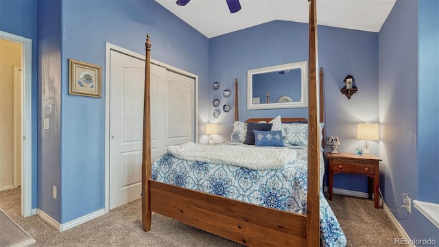bedroom featuring a closet, carpet floors, baseboards, and vaulted ceiling
