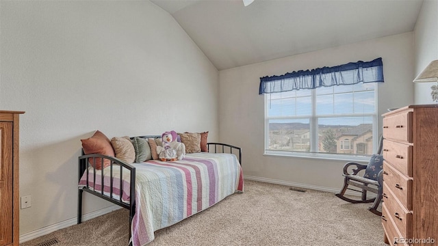bedroom featuring baseboards, visible vents, vaulted ceiling, and light colored carpet