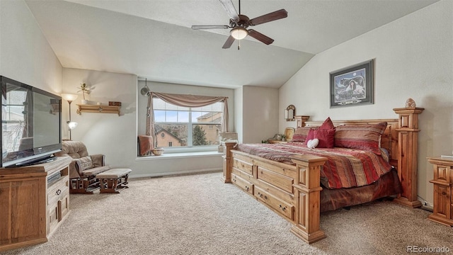 carpeted bedroom with baseboards, a ceiling fan, and lofted ceiling