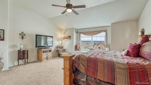carpeted bedroom with a ceiling fan, baseboards, and vaulted ceiling