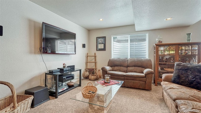 living room featuring carpet floors, a textured wall, recessed lighting, and a textured ceiling