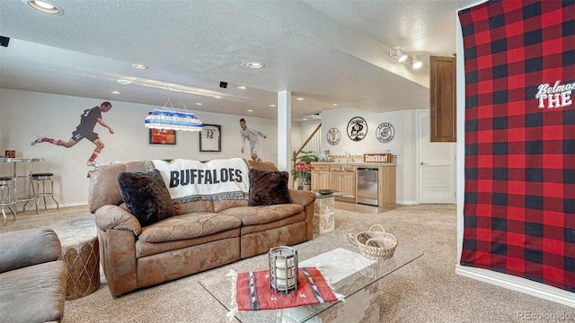 carpeted living room featuring recessed lighting, a textured ceiling, a dry bar, and baseboards