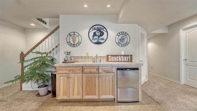 bar with wet bar, light colored carpet, a sink, and dishwashing machine