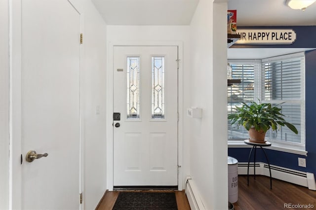 entrance foyer featuring a baseboard radiator and dark hardwood / wood-style floors