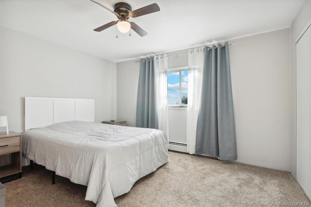 bedroom with light carpet, a baseboard radiator, and ceiling fan