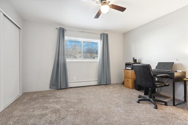 carpeted office with a baseboard heating unit and ceiling fan