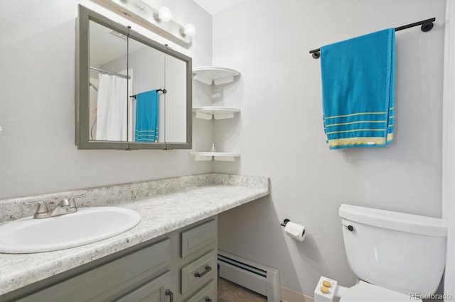 bathroom with vanity, a baseboard radiator, and toilet