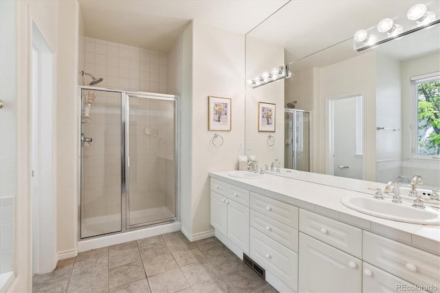 335 Josephine St Unit D, Denver, CO 80206 - full bath with a stall shower, double vanity, and tile patterned flooring