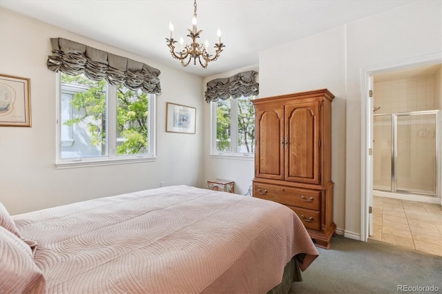 335 Josephine St Unit D, Denver, CO 80206 - carpeted bedroom featuring a chandelier, ensuite bathroom, and tile patterned floors