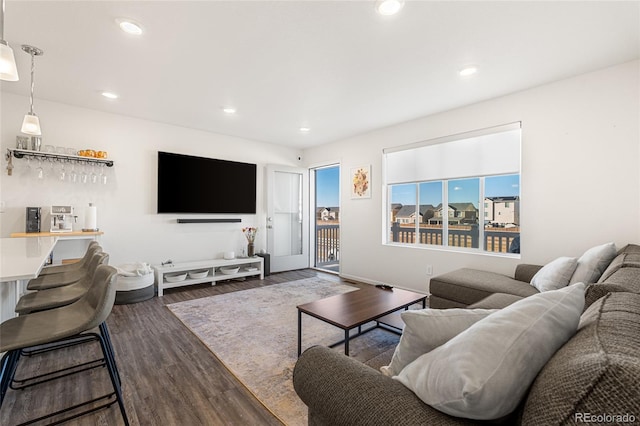 living area featuring dark wood-style floors and recessed lighting