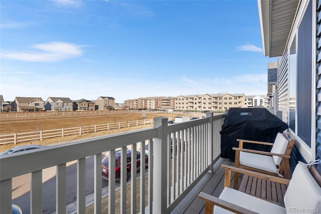 balcony with grilling area and a residential view