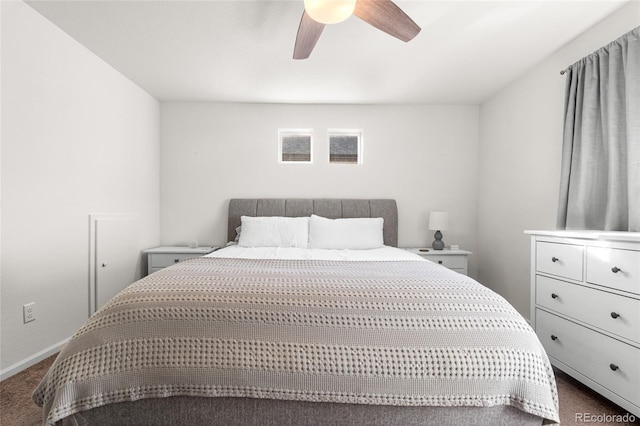 bedroom featuring ceiling fan, dark colored carpet, and baseboards