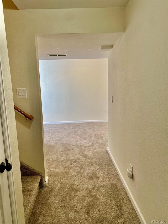 hallway featuring carpet flooring