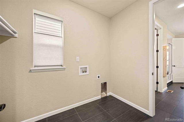 clothes washing area with laundry area, baseboards, dark tile patterned flooring, hookup for an electric dryer, and washer hookup