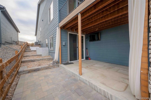 view of patio / terrace featuring fence