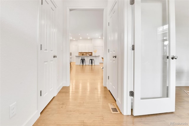 hall featuring light hardwood / wood-style flooring