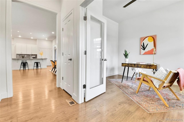 corridor featuring light hardwood / wood-style flooring