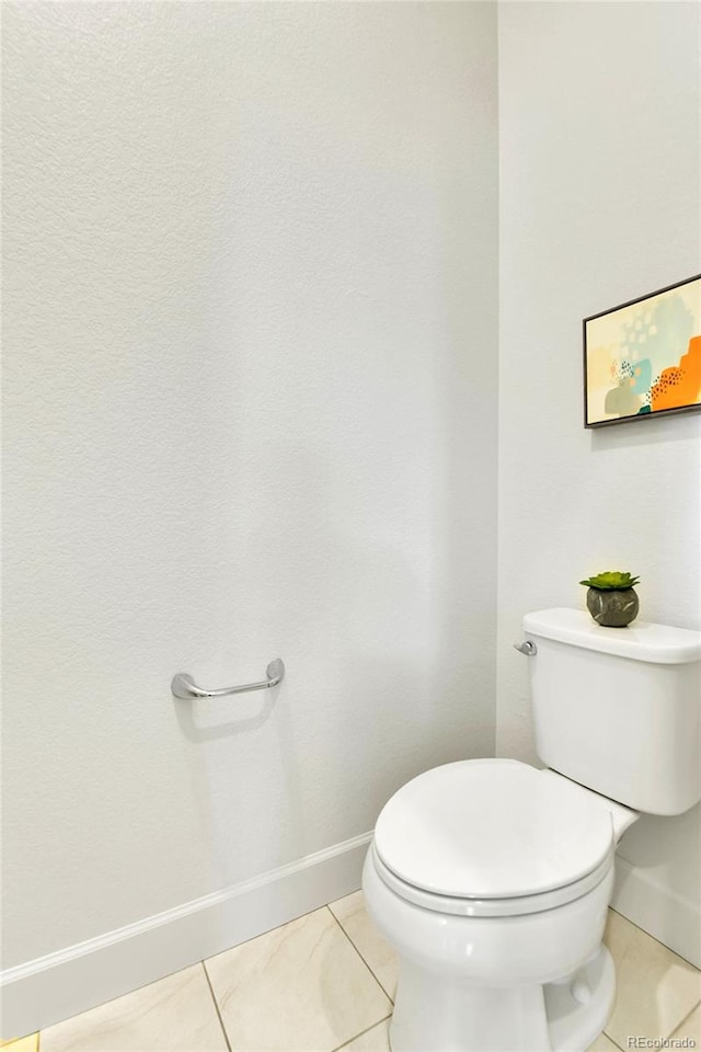 bathroom featuring tile patterned flooring and toilet