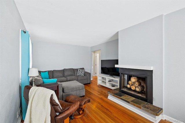 3492 S Elm St, Denver, CO 80222 - living room with a fireplace with raised hearth and wood finished floors
