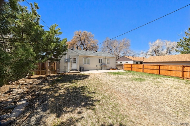 3492 S Elm St, Denver, CO 80222 - back of property with a patio and central AC unit