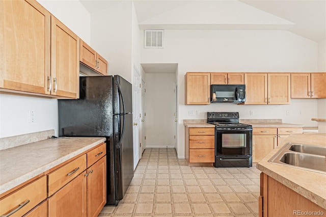 kitchen with sink, high vaulted ceiling, black appliances, and light brown cabinets