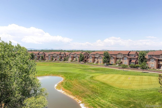 view of home's community with a yard