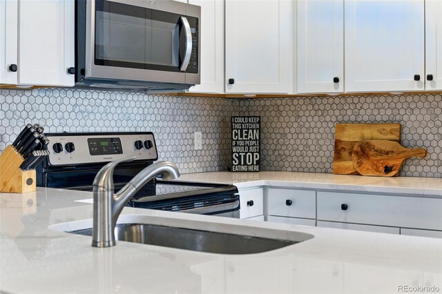 interior space with laundry area and a sink