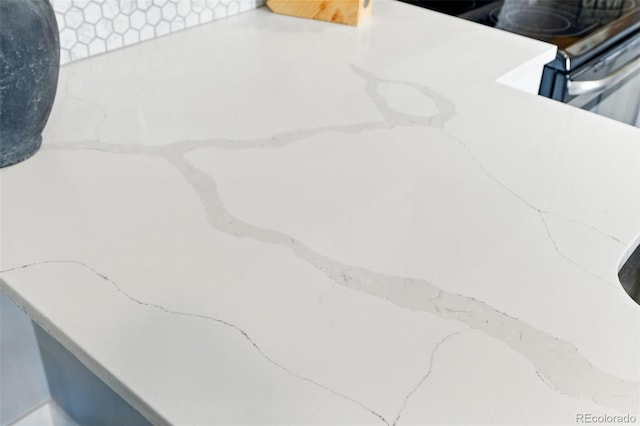 interior details featuring range with electric stovetop