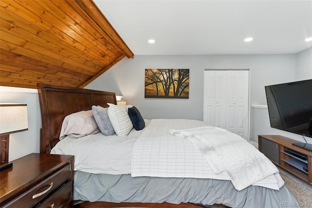 bedroom featuring a closet, recessed lighting, and vaulted ceiling