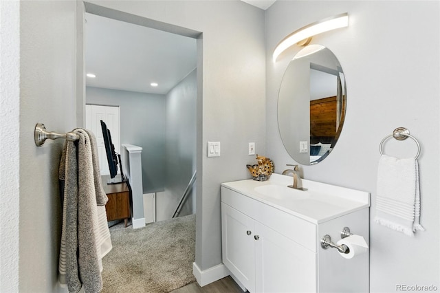 bathroom with vanity and baseboards