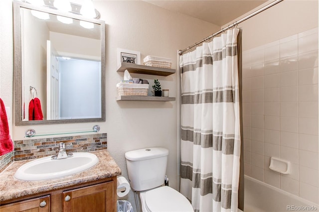 full bathroom featuring shower / tub combo with curtain, vanity, and toilet