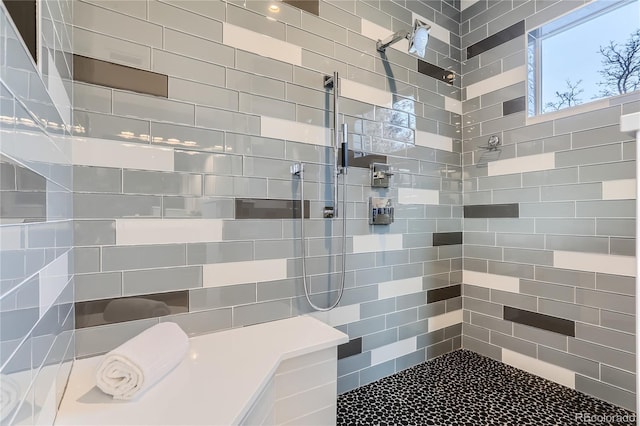 full bathroom with a tile shower