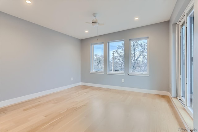 unfurnished room with recessed lighting, a ceiling fan, light wood-style floors, and baseboards