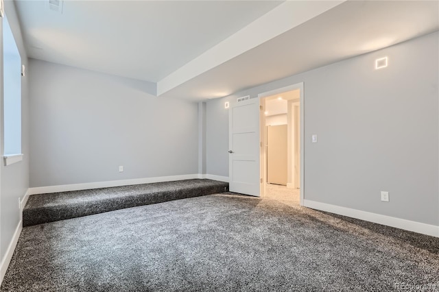 spare room with visible vents, baseboards, and carpet flooring