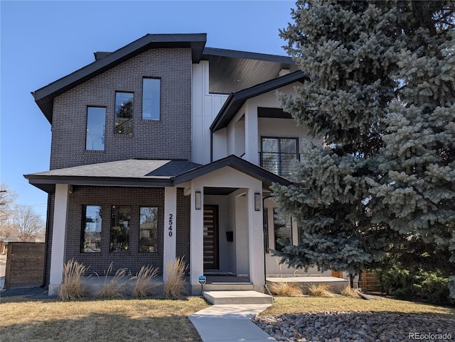 view of front of house featuring brick siding