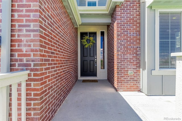 12941 Delaware St, Westminster, CO 80234 - doorway to property featuring brick siding